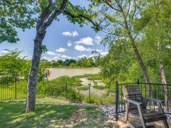 View of yard featuring a water view and fence | Image 26