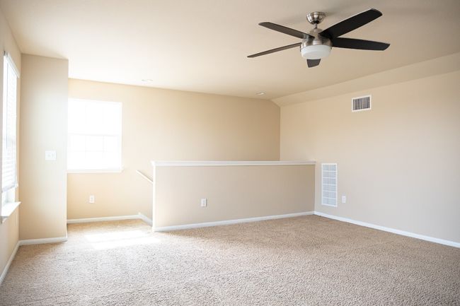 Spare room featuring carpet floors, ceiling fan, and baseboards | Image 21