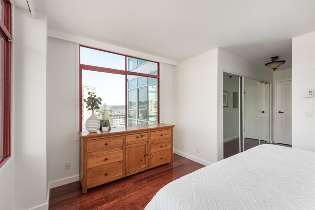 Bedroom featuring dark wood-style floors and a closet | Image 24