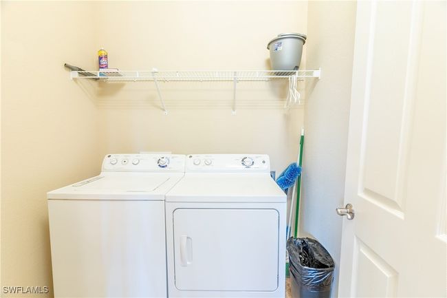 Washroom with laundry area and washer and clothes dryer | Image 24