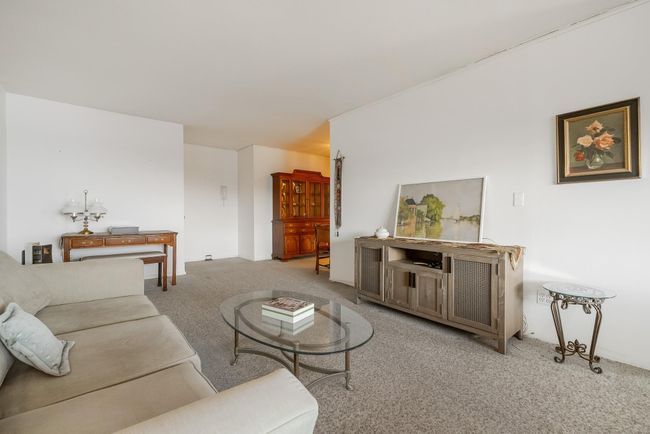Bright living room looking toward entry door | Image 8