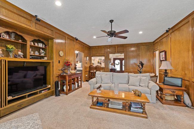 This warm, inviting space offers plenty of room for comfortable seating, perfect for relaxing with family or entertaining guests. | Image 12