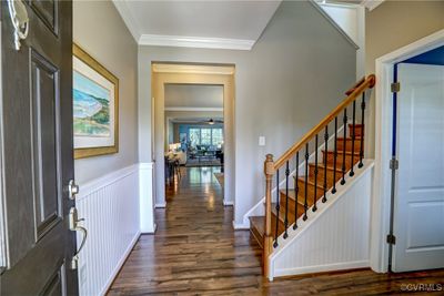 The foyer is adorable. The beadboard wainscoting is so charmingly warm and inviting! Note the upgraded, handsome, wrought iron spindles that balance the sweetness with gravitas. | Image 3