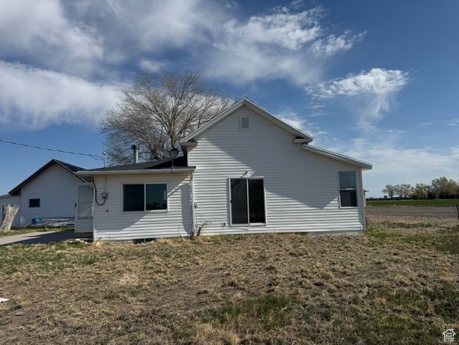 Back of house with a lawn | Image 13