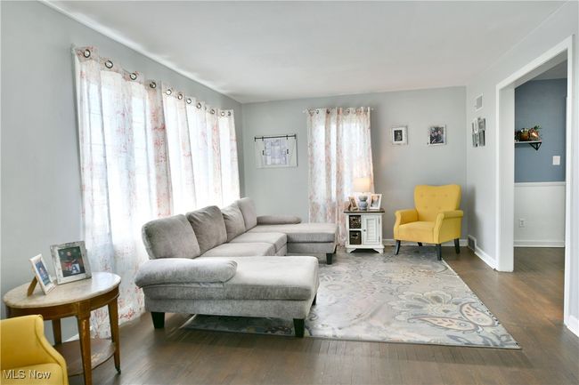 Living area with dark wood-style floors and baseboards | Image 20