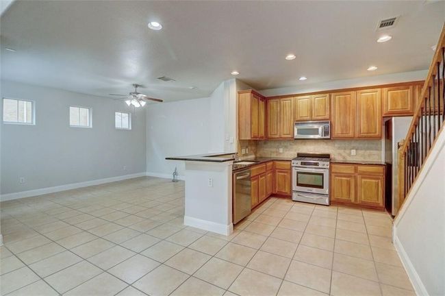 DINING ROOM WITH OPEN FLOOR PLAN TO KITCHEN & LIVING ROOM | Image 8