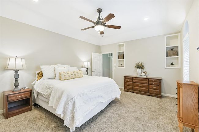 This downstairs primary suite offers enhanced privacy and comfort. | Image 23