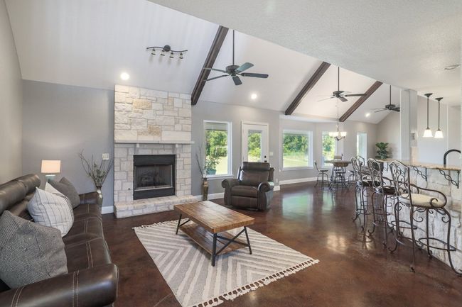 Vaulted, beamed ceilings create a spacious airy atmosphere. | Image 6