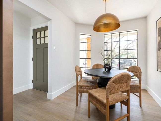 Dining space featuring baseboards and light wood-style flooring | Image 16