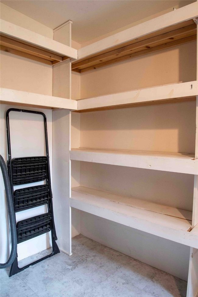 View of spacious closet used as pantry off the kitchen and dining area | Image 32
