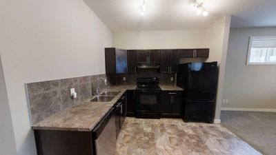 A - 8713 88 St, House other with 2 bedrooms, 1 bathrooms and null parking in Grande Prairie AB | Image 2