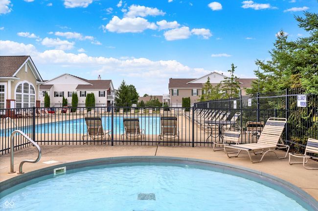 community pool featuring a patio area | Image 38