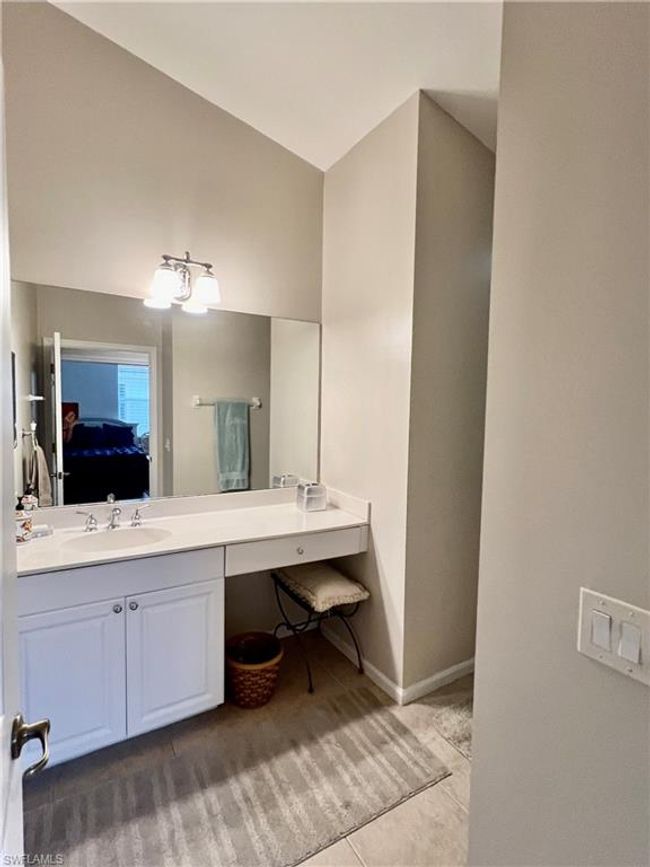 Guest bath with white cultured marble counter and sink. | Image 28