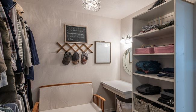 Walk in closet with a chandelier | Image 19