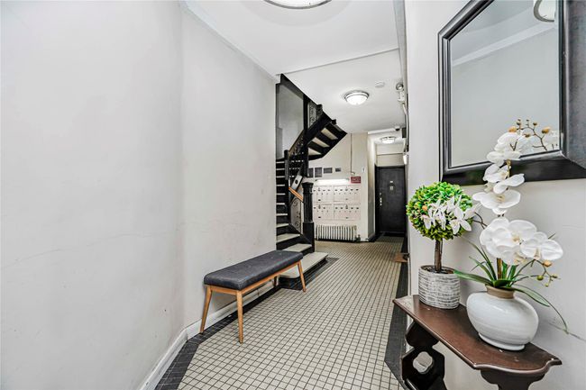 Corridor with stairs, radiator, and tile patterned floors | Image 30