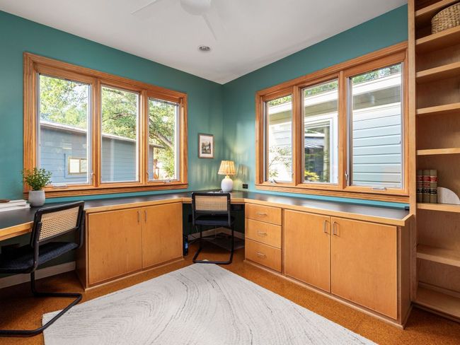 Dedicated office space with French doors, custom-built dual workstations, cabinetry, bookshelves and built-in file cabinets; Cat-5 telecom wiring. | Image 8