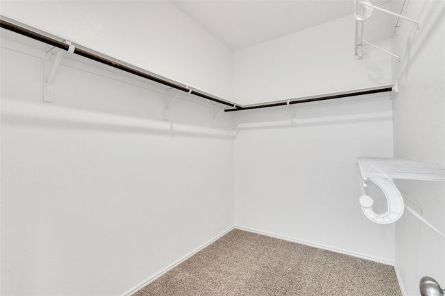 Spacious closet with carpet flooring | Image 22