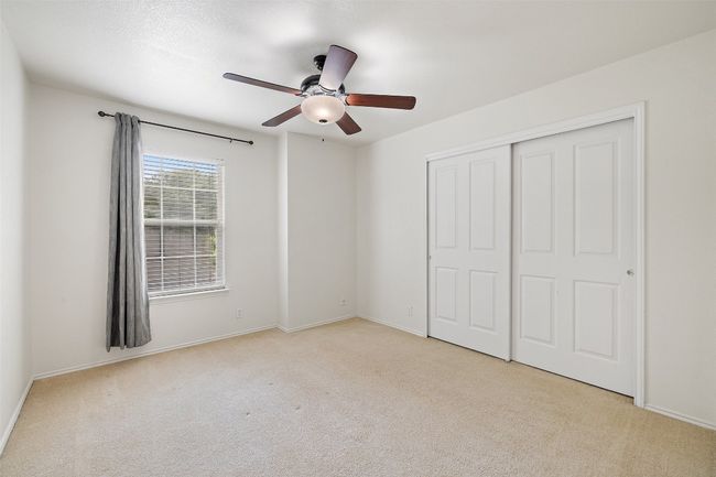 Unfurnished bedroom with carpet floors, baseboards, and a closet | Image 36