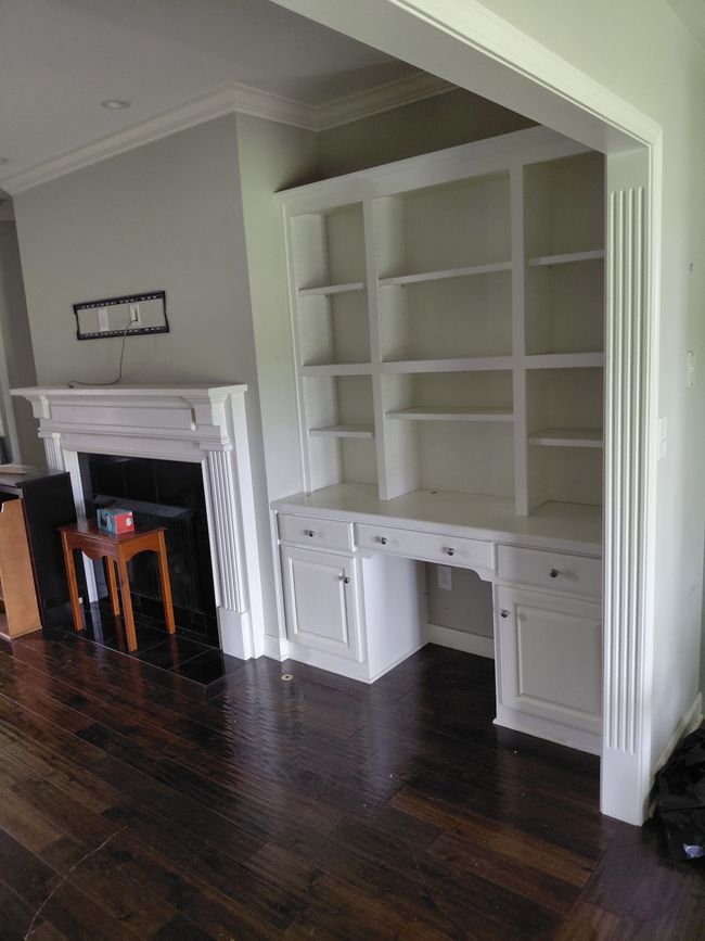 Custom built-in with fireplace and hardwoods throughout. | Image 4