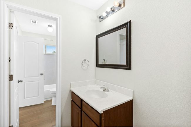 Bathroom featuring vanity and wood finished floors | Image 21