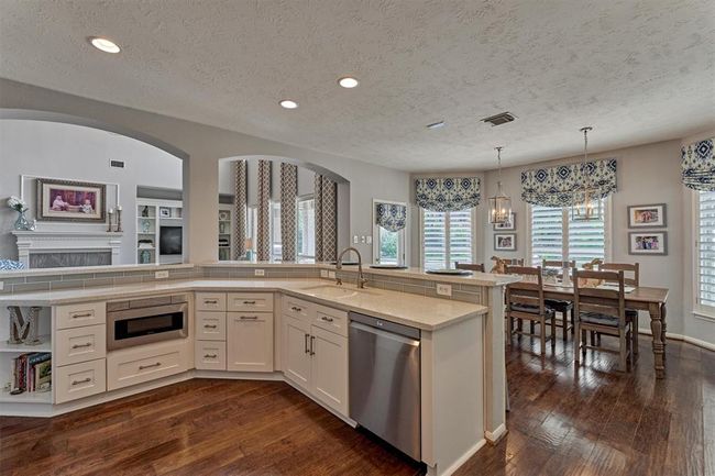 Moving from hallway with Half Bath and Mudroom/Laundry you will enter this large kitchen with separate Breakfast area. Kitchen is open to Family Room. | Image 18