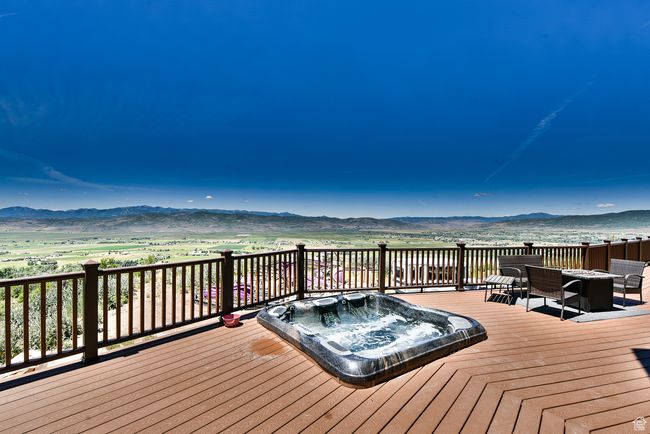 Wooden terrace with hot tub deck surround and a mountain view | Image 52
