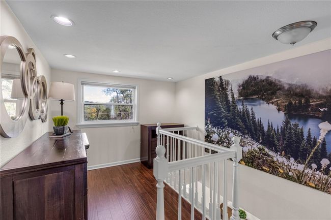 Upper level landing that can be used as a reding nook or extra home office. | Image 24