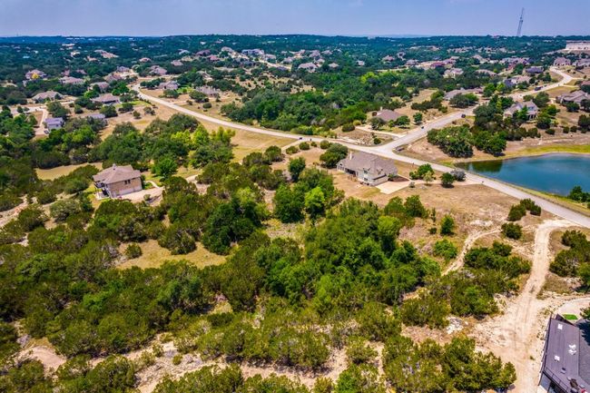 Aerial view of property's location with pond in front of property | Image 34