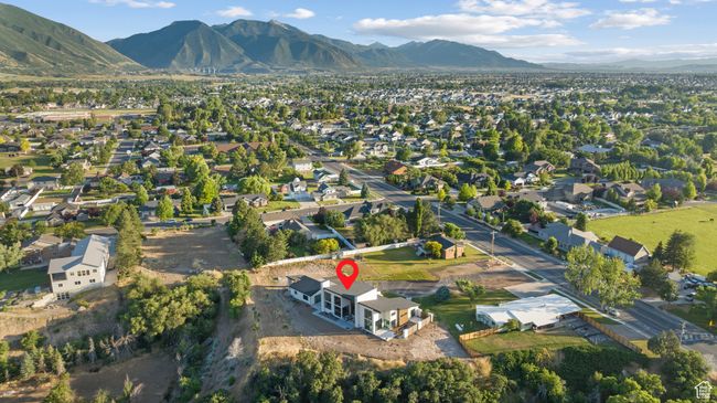View of property location with a mountainous background and nearby suburban area | Image 97
