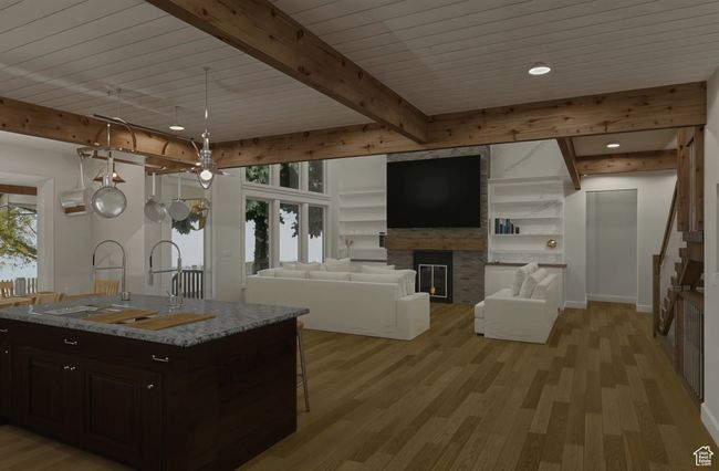 Optional kitchen featuring a breakfast bar, a stone fireplace, a sink, light wood-style floors, and beam ceiling | Image 4