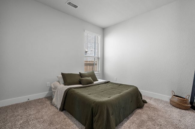 Bedroom with carpet floors and a textured wall | Image 21