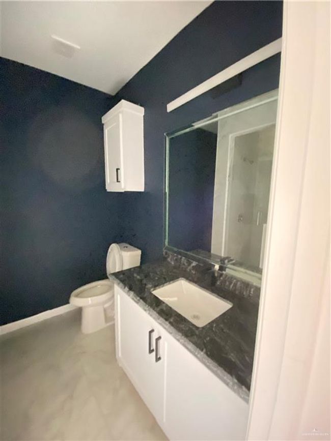 Bathroom featuring vanity and a stall shower | Image 16