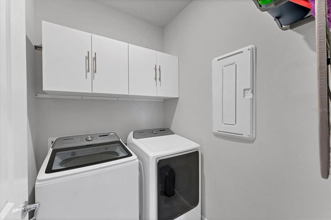 Laundry Room has cabinets above | Image 27