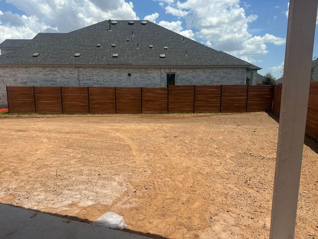 View of fenced backyard | Image 7