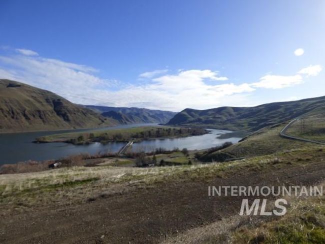 View of mountain backdrop with a large body of water | Image 30