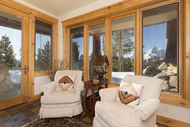 Entry level Bedroom 2 sitting area with Lone Mountain views and exit to exterior patio seating. | Image 56