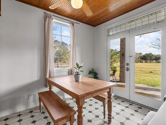 French doors lead seamlessly to the back covered patio, creating an easy flow between indoor and outdoor living, perfect for entertaining! | Image 20