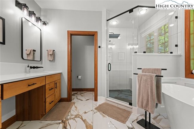 Primary Bedroom En-Suite with Porcelain Floors | Image 15