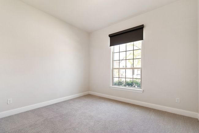 Carpeted empty room featuring baseboards | Image 5