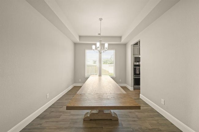 Sunlit dining space with direct access to the kitchen for effortless entertaining. | Image 7