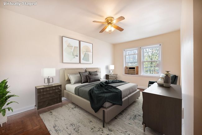 Bedroom featuring cooling unit, a ceiling fan, wood finished floors, and baseboards | Image 13