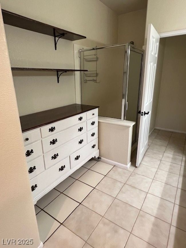 Unfurnished bedroom with a ceiling fan, visible vents, baseboards, a closet, and light tile patterned flooring | Image 20