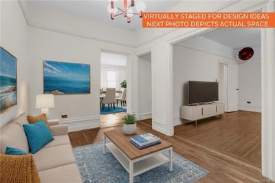 Virtually Staged seating area with a chandelier and wood-type flooring | Image 1