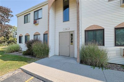 View of exterior entry with a yard | Image 1