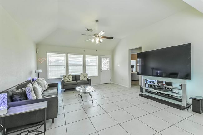 Another view of the living room showing entrance to the Primary bedroom. | Image 15
