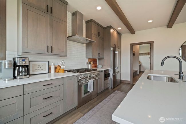 This kitchen has everything you need and want - counter space, cabinets, top of the line appliances and more | Image 7