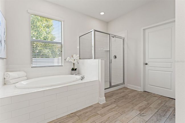 Primary bathroom on first floor with tub & shower | Image 20