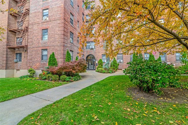 View of property's community with a lawn | Image 12