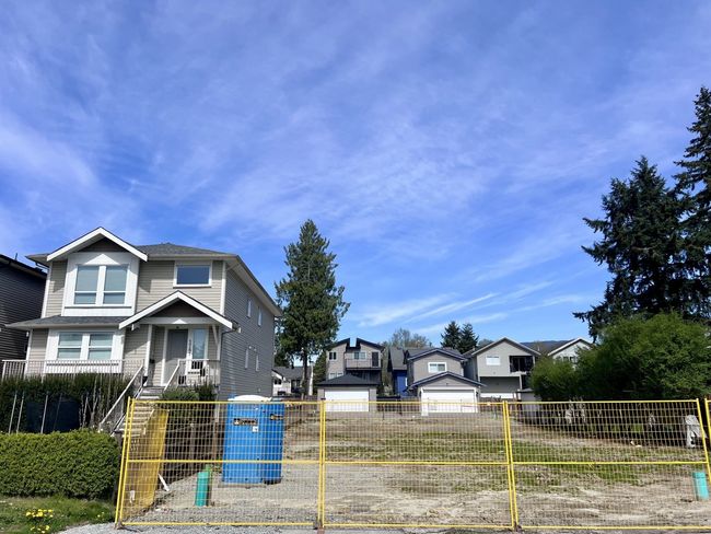 Traditional home featuring a residential view and a fenced front yard | Image 5