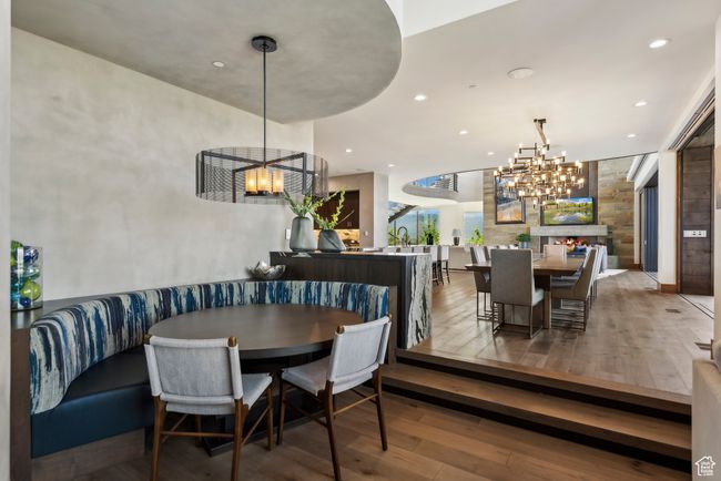 Dining area with a chandelier, hardwood / wood-style flooring, and recessed lighting | Image 18